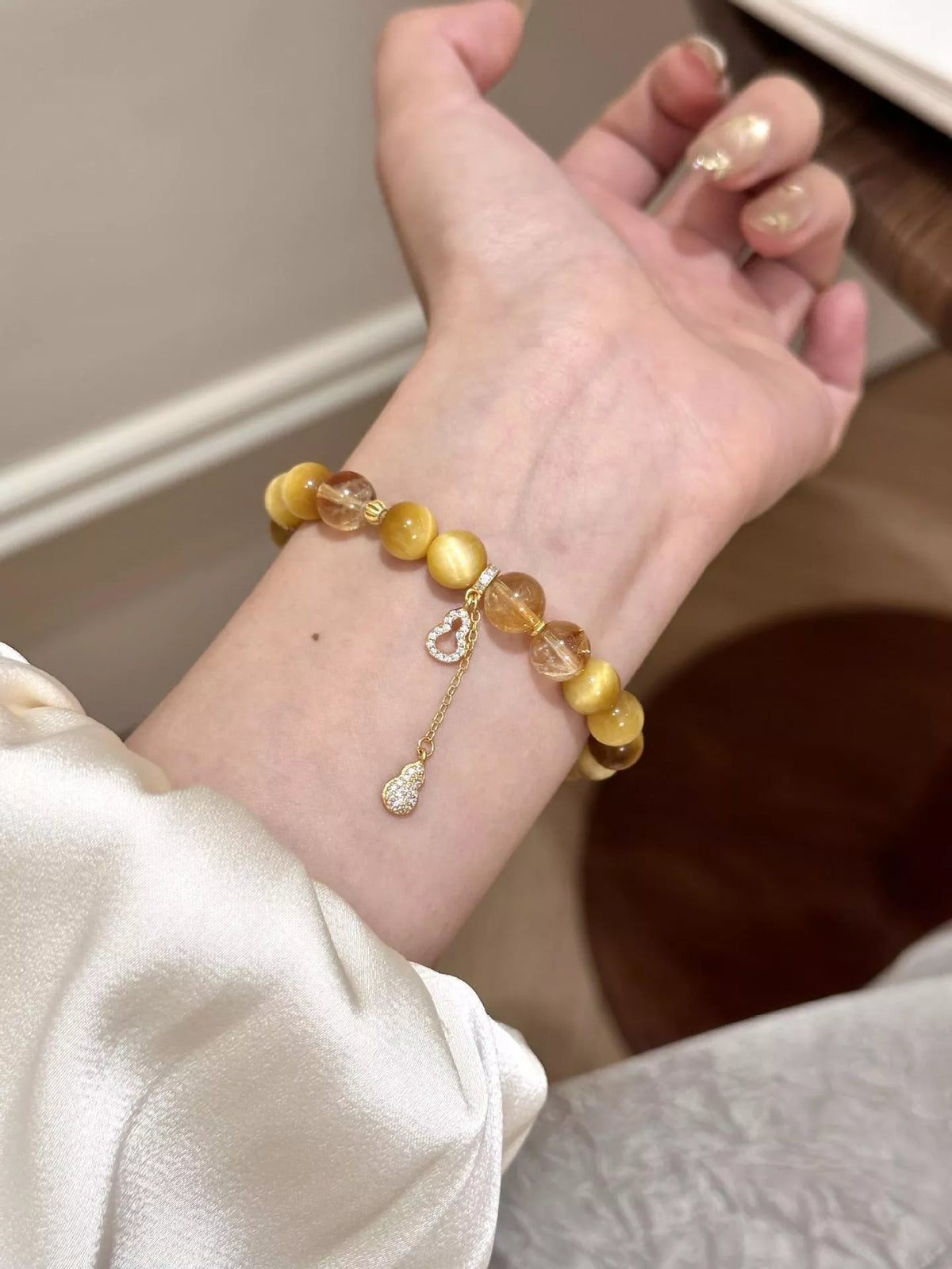 Bracelet Perlé Œil de Tigre Breloque Calebasse